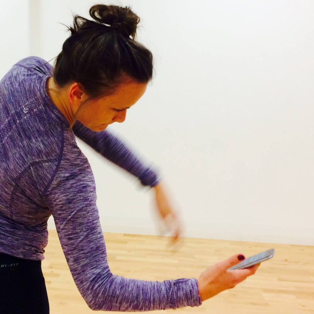 Image of woman dancing with mobile phone